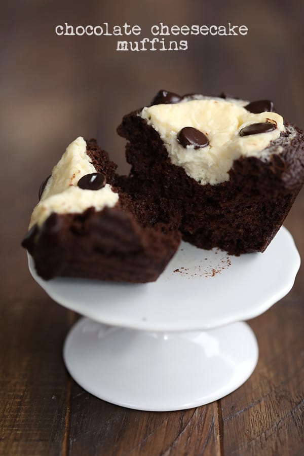 A keto chocolate cream cheese muffin on a cupcake stand, cut open to see the inside.