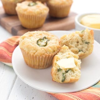 Cheddar Jalapeno Muffins with butter slathered on them.