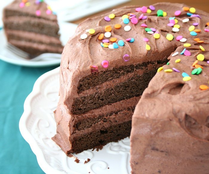 sugar-free chocolate layer cake with a slice removed so you can see the 4 layers inside