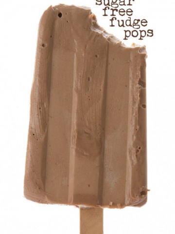 Sugar-free fudge pop held up with a bite taken out of it