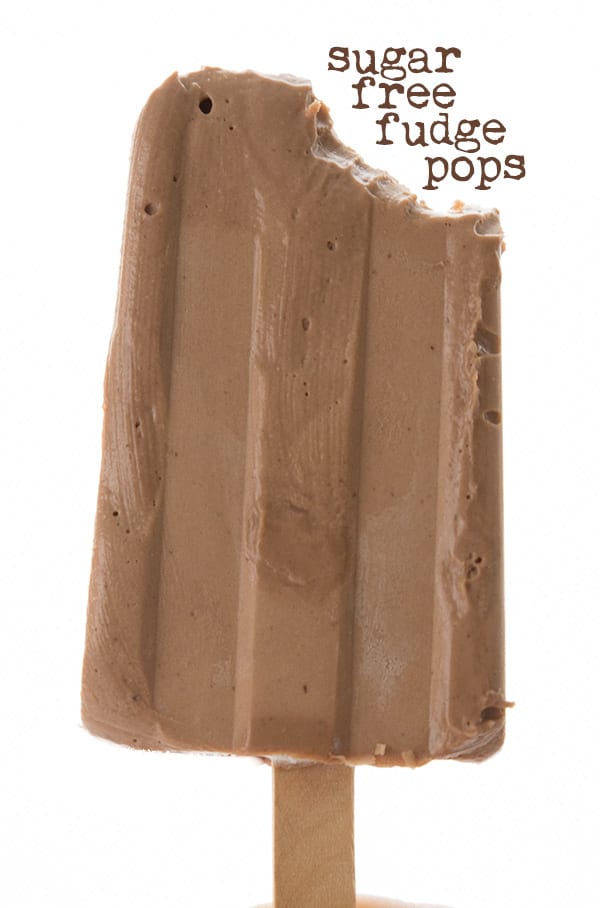 Sugar-free fudge pop held up with a bite taken out of it