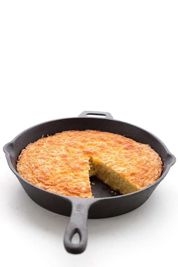 cheesy keto skillet bread baked into a cast iron pan