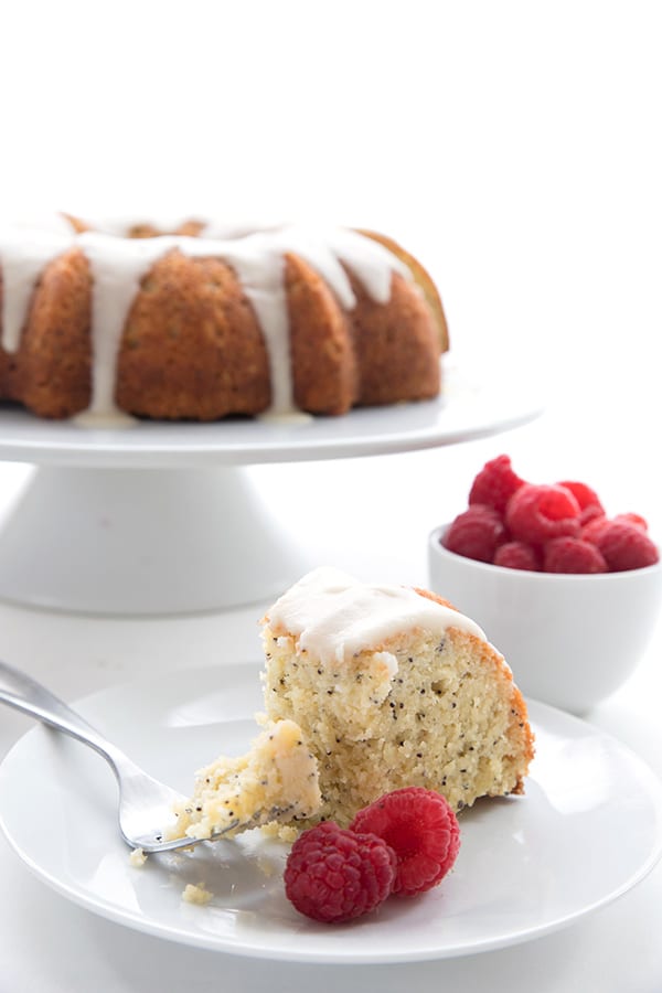 The best low carb lemon poppy seed cake! A slice with a forkful taken out of it. 