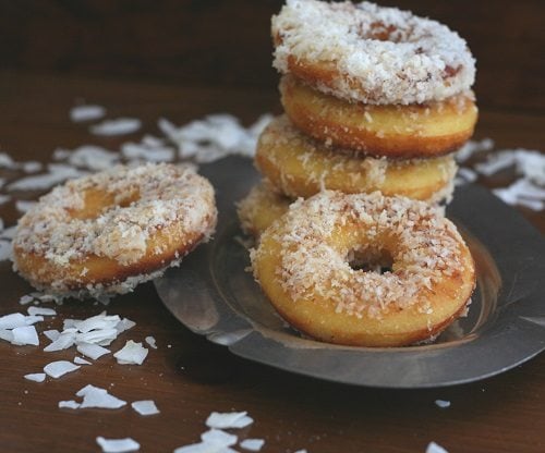 a stack of gluten-free fried donuts made with coconut flour sitting on a plate