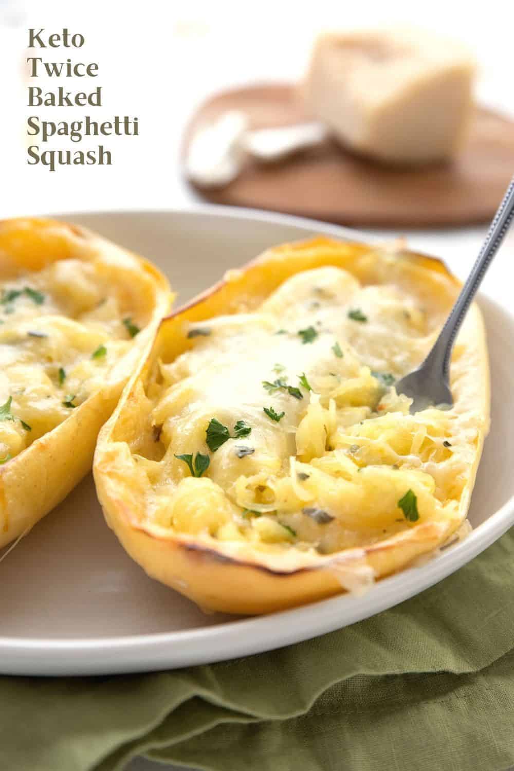 Titled image of twice baked spaghetti squash in the skin, in an oval dish. A fork is digging into it. 
