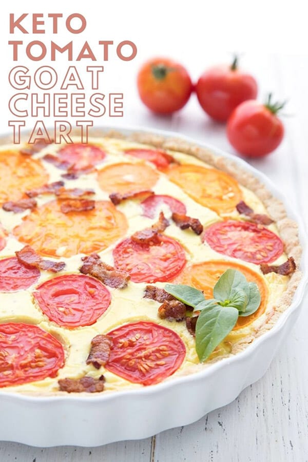 Titled image of goat cheese tart with tomatoes and bacon, in a white tart pan. 