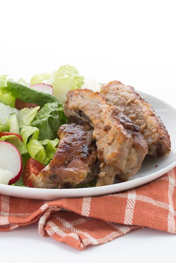 Keto ribs on a plate with salad