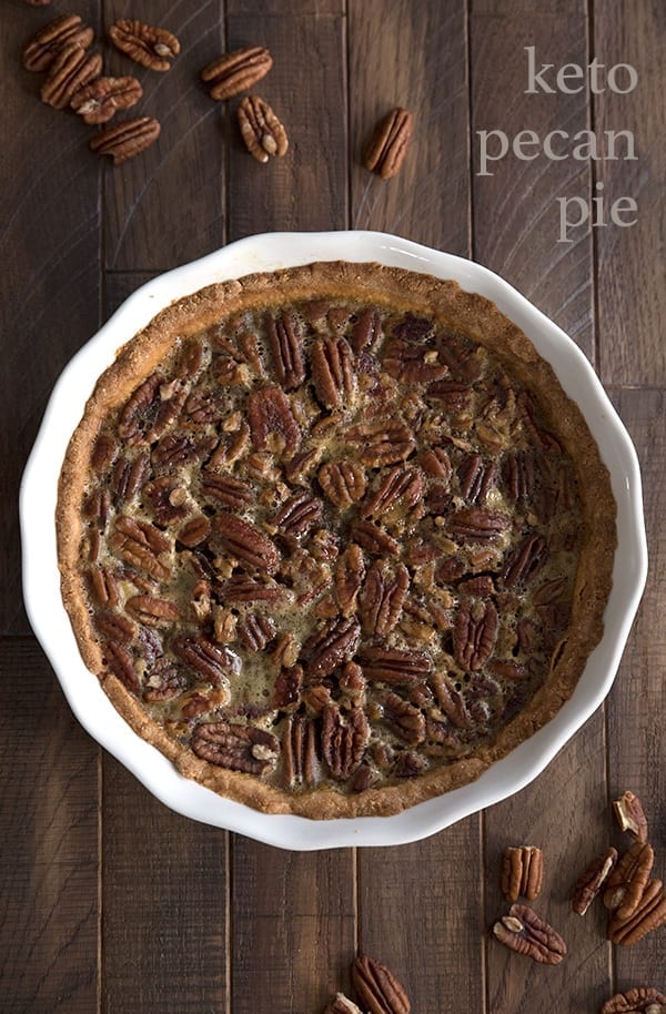 Top down photo of sugar free pecan pie on a brown wooden table