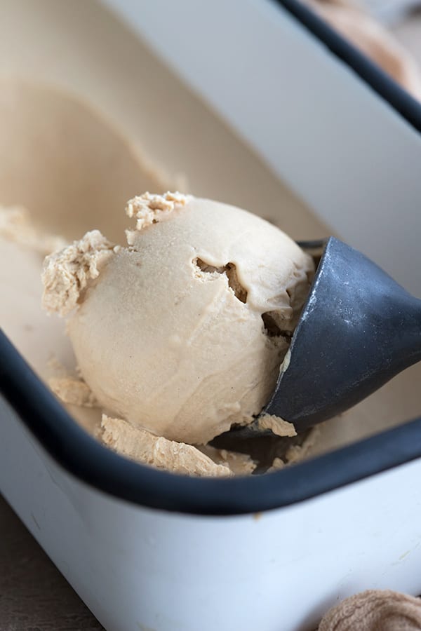 Close up shot of an ice cream scoop full of keto no-churn coffee ice cream