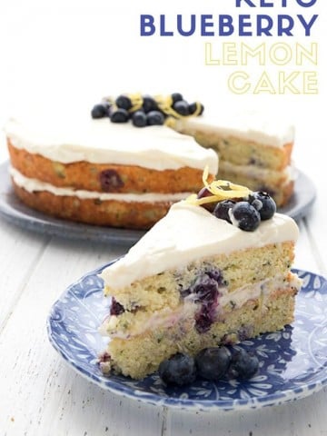 Titled image with a slice of Keto Lemon Blueberry Zucchini Cake on a blue patterned plate, with the rest of the cake in the background