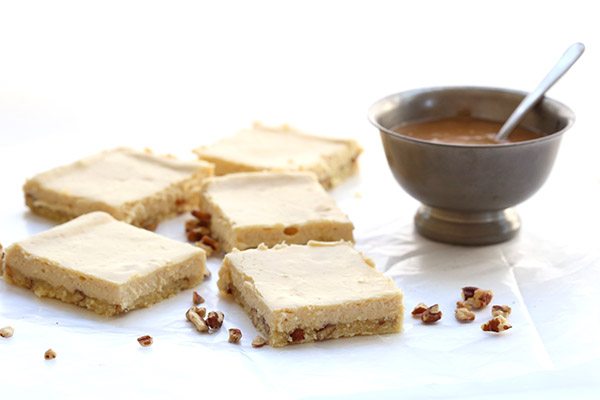 The best low carb cheesecake bars with a grain-free pecan shortbread crust and delicious salted caramel sauce.