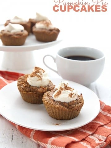 Keto Pumpkin Pie Cupcakes on a white plate with an orange napkin and more cupcakes in the background