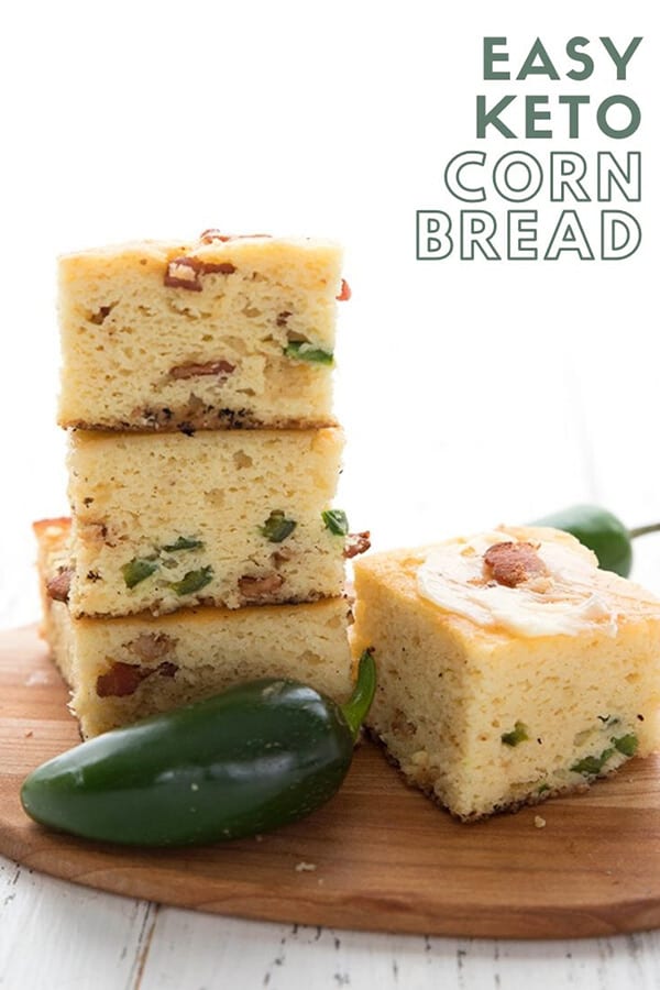 Titled image of a stack of keto cornbread on a wooden cutting board