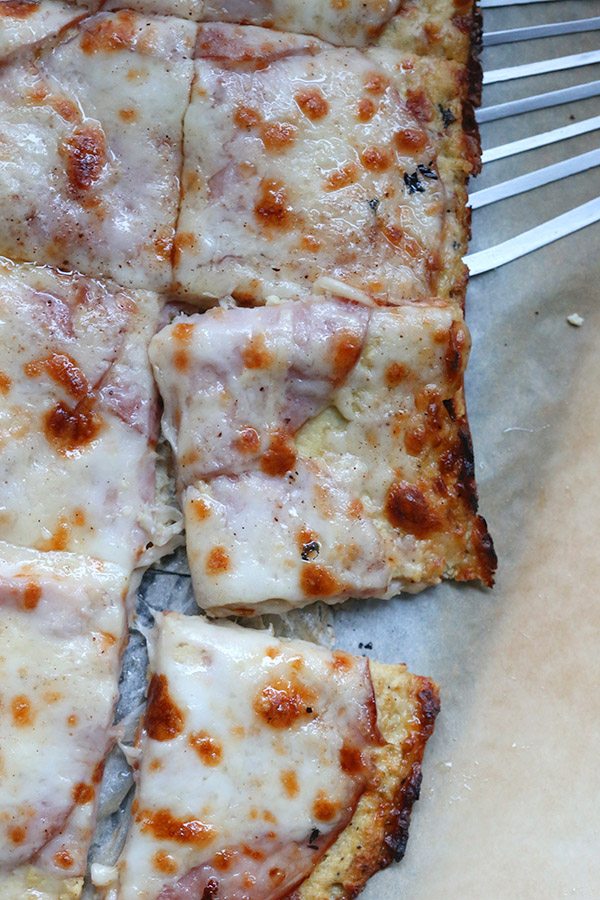 A healthy Croque Monsieur? With a low carb cauliflower crust, this famous sandwich becomes a delicious ham and cheese pizza.