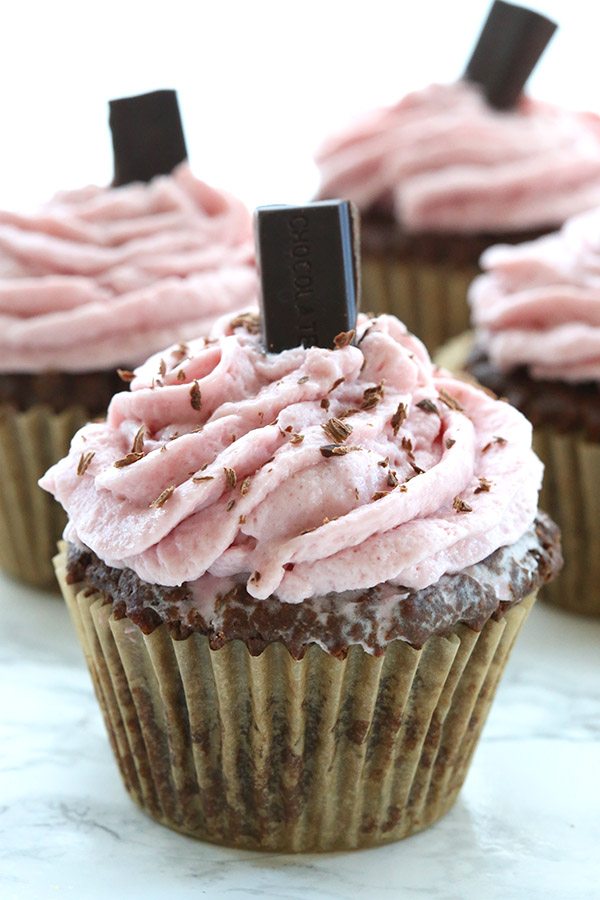 A perfectly healthy Valentine's Day treat: low carb chocolate cupcakes filled with sugar-free raspberry jam and topped with a raspberry cream cheese frosting