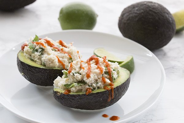 Add a little sriracha to your crab-stuffed avocado for a delicious and spicy ketogenic meal!