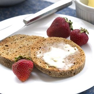 Low carb, grain-free English muffins with butter. Best keto breakfast ever! Nut-free, can be dairy-free and paleo friendly.