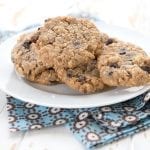 Keto oatmeal cookies on a plate over a blue patterned napkin.