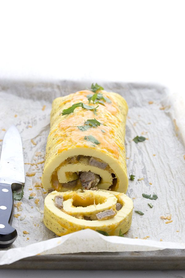 Slice and serve sausage and cheese omelet roll.