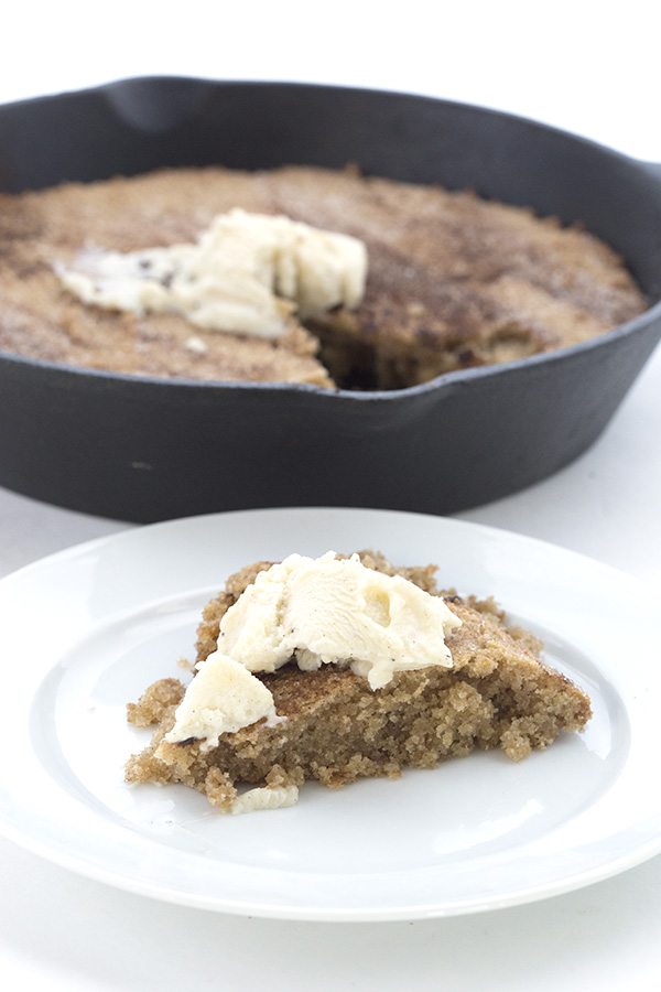 Warm cinnamon-y low carb Snickerdoodle dough baked in a skillet and topped with sugar-free ice cream!