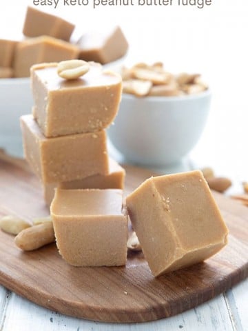 Titled image of keto peanut butter fudge cut into squares on a wooden cutting board