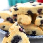 Titled Pinterest image of a keto blueberry scone in a gray table.