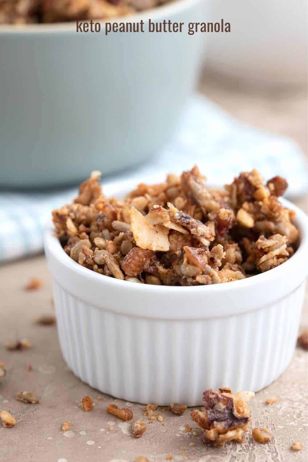 Low carb granola in a white ramekin on a brown table. 