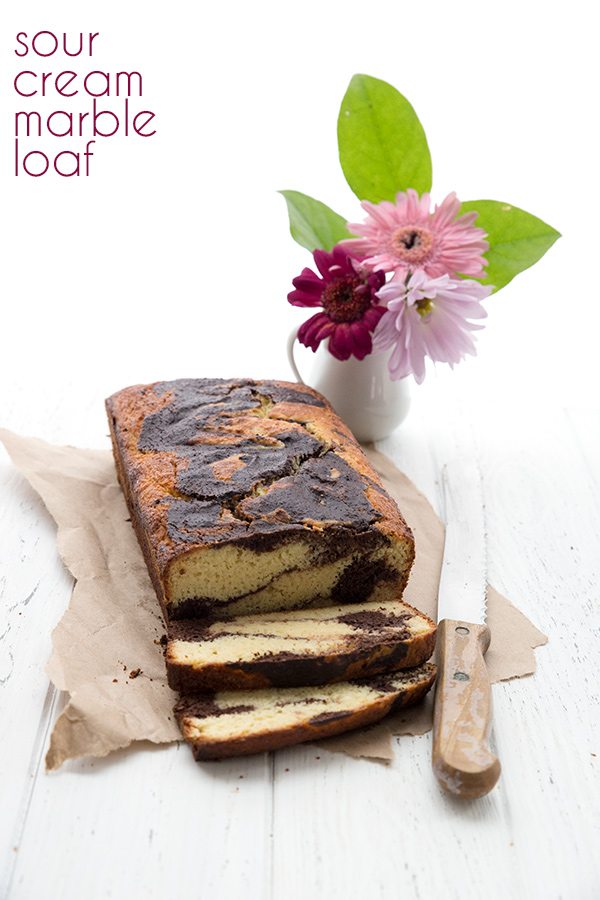 Low carb marble loaf cake cut into slices with flowers
