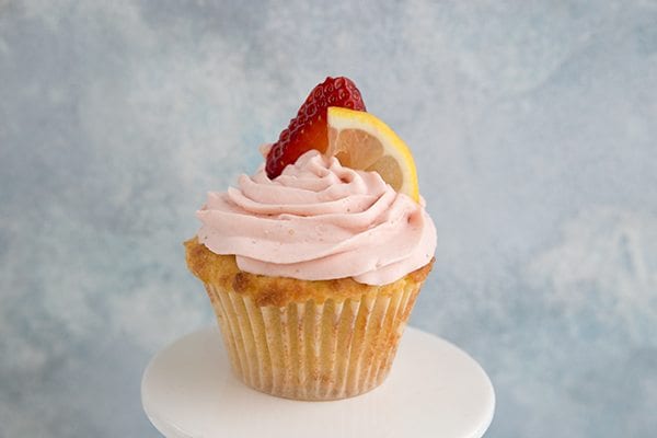 Sweet low carb Strawberry Lemonade Cupcakes on a white plate