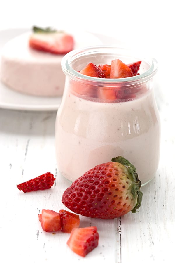 Easy Low Carb Strawberry Panna Cotta in a jar with chopped berries