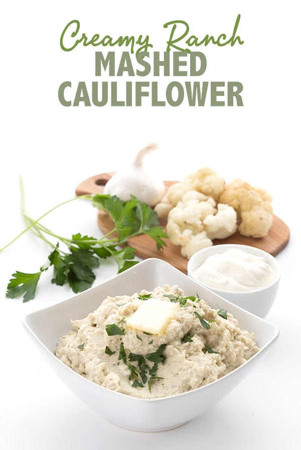 Creamy mashed cauliflower in a bowl with butter melting. Title photo