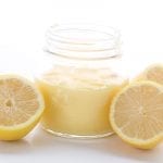 Low carb lemon curd in a jar with lemons