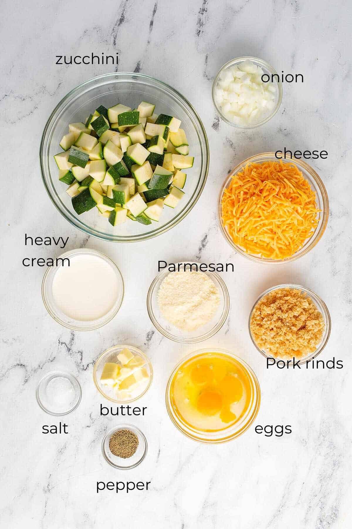 Top down image of the labeled ingredients for easy zucchini casserole.
