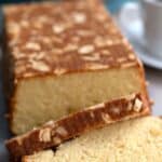 Titled image showing a low carb almond flour loaf cake with several slices cut in front.