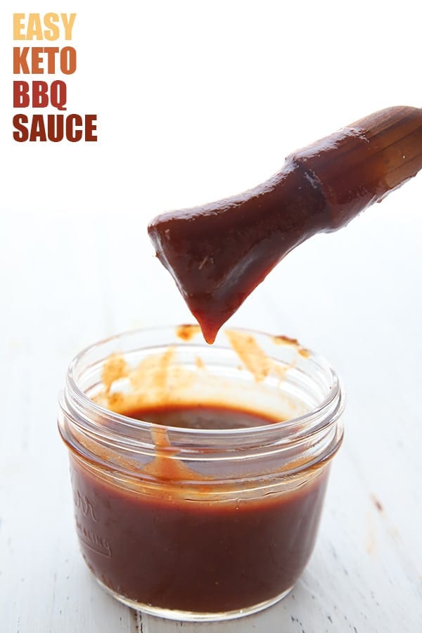 Sugar Free BBQ Sauce in a jar, with a brush above it
