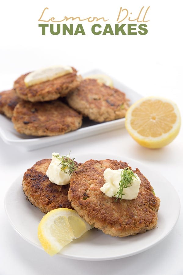 Keto Tuna Patties on a white plate with lemon slices, mayonnaise, and dill