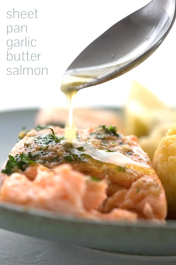 Easy salmon recipe with garlic butter being drizzled over