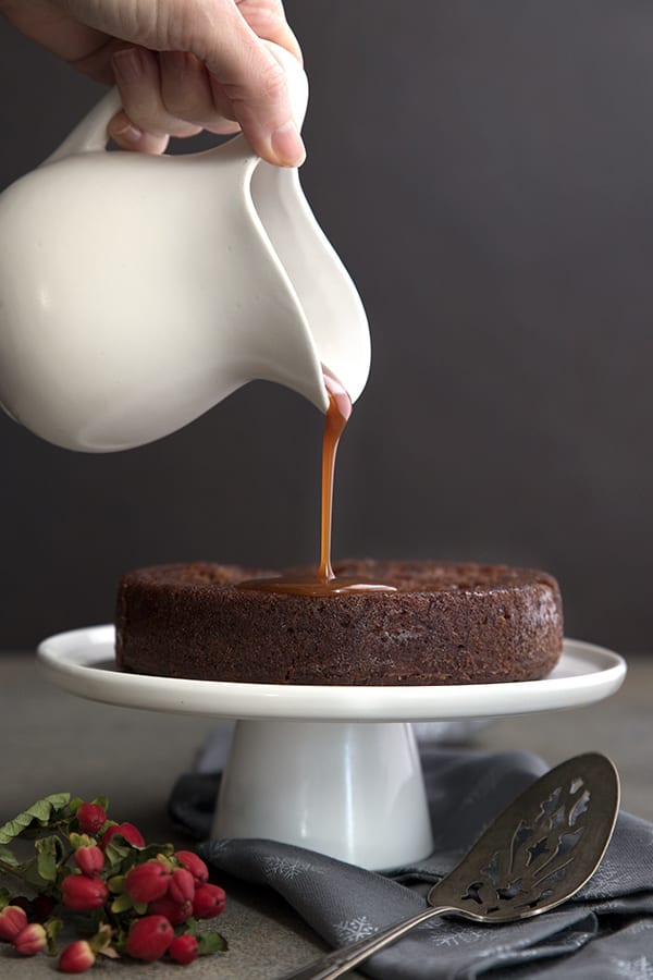 Sugar free toffee sauce pouring over Sticky Toffee Pudding Cake