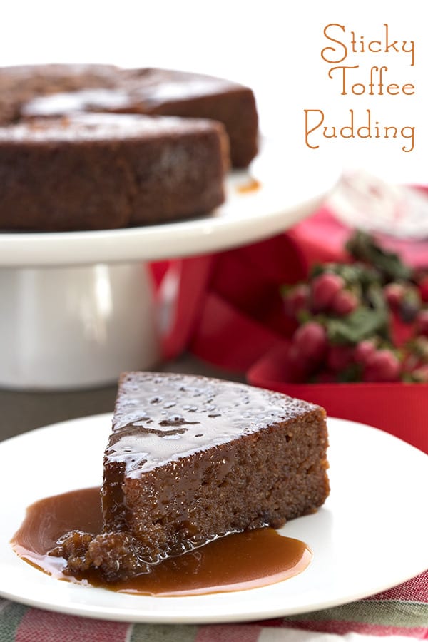 Keto Sticky Toffee Pudding on a white plate with holiday napkins