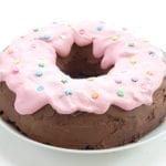 Keto Chocolate Donut Cake on a white cake stand