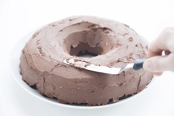 Keto chocolate frosting on a keto bundt cake