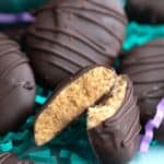 Titled image close up of Keto Peanut Butter Easter eggs with one broken open.