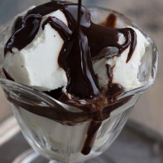 Close up of keto ice cream with sugar free chocolate syrup