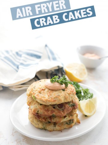 Air Fryer Crab Cakes in a stack on a white plate