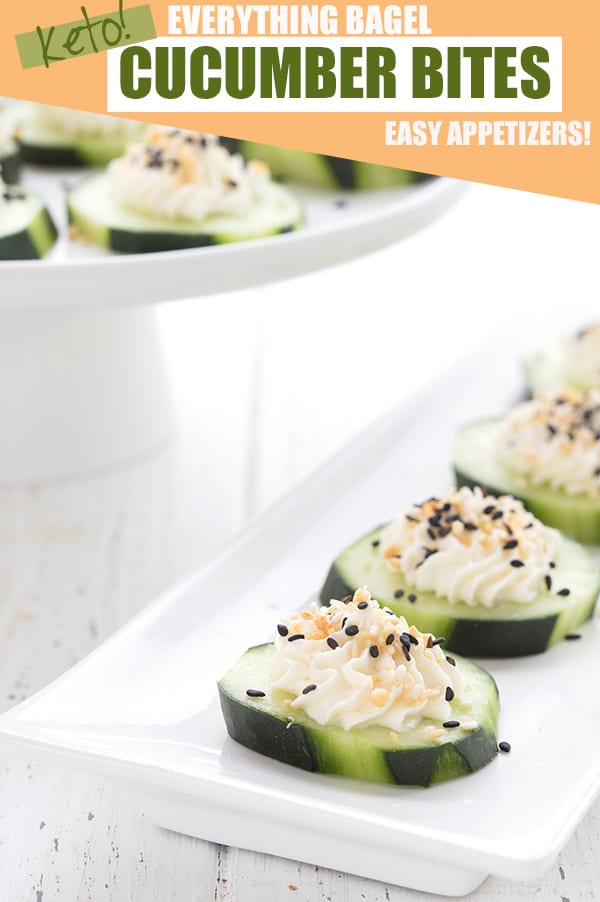 Cucumber appetizers with cream cheese and everything bagel seasoning on a tray
