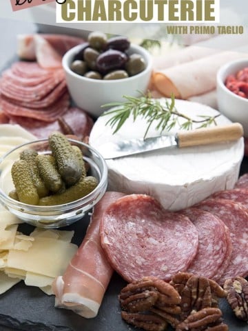 Keto appetizers tray with meats, cheeses and salted pecans