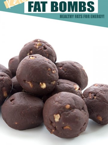 Keto chocolate fat bombs in a pile on a white background