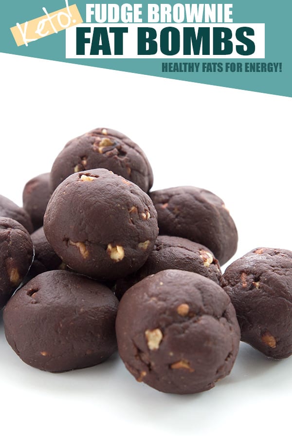 Keto chocolate fat bombs in a pile on a white background