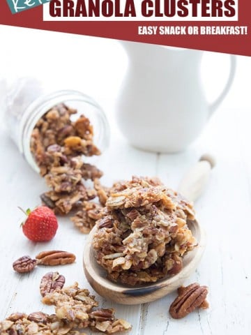 Large clusters of grain-free keto granola in a wooden scoop on a white table