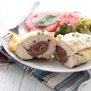 Keto stuffed chicken breast cut in half to show the fillings